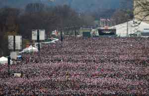 Crowds of people gather on the mall to watch the swearing-in of U.S. President Barack Obama in Washington